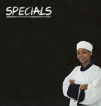African American woman chef with chalk specials sign on blackboard Background