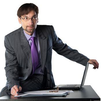 business man sitting on a desk with a laptop