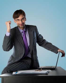 business man at his desk with a laptop showing a gesture output