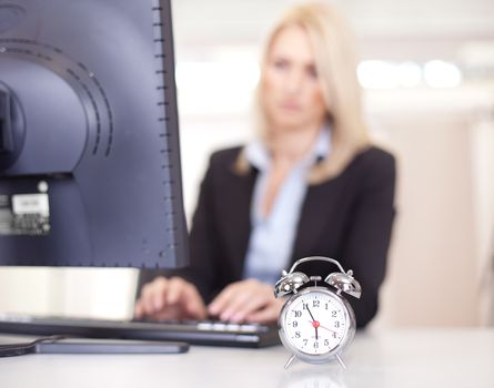 Beautiful businesswoman trying to meet a deadline in the office