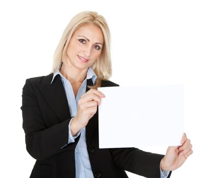 Cheerful businesswomen presenting empty board. Isolated on white
