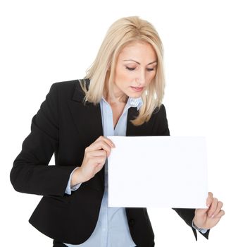 Cheerful businesswomen presenting empty board. Isolated on white
