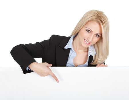 Cheerful businesswomen presenting empty board. Isolated on white