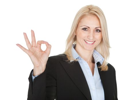 Beautiful business woman making a gun gesture. Isolated on white