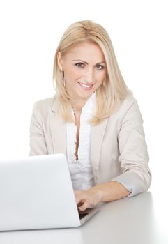 Beautiful businesswoman working on computer in the office