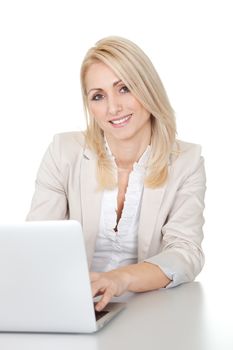 Beautiful businesswoman working on computer in the office