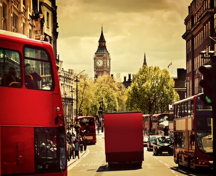 Busy street of London, England, the UK. Red buses, Big Ben in the background. 