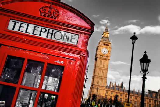 Red telephone booth and Big Ben in London, England, the UK. The symbols of London on black on white sky.