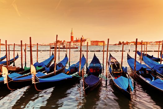 Venice, Italy. Gondolas on Grand Canal at sunset. San Giorgio Maggiore in the background