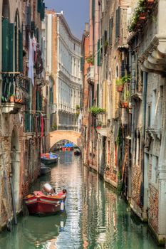 Venice, Italy. A romantic narrow canal and bridge among old Venetian architecture