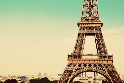 Eiffel Tower middle section, the city in the background, Paris, France. Vintage, retro style