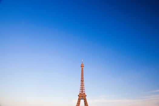 Eiffel Tower, the city in the background, sky copyspace. Paris, France