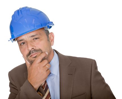 Thoughtful architect wearing a hard hat isolated on white background.