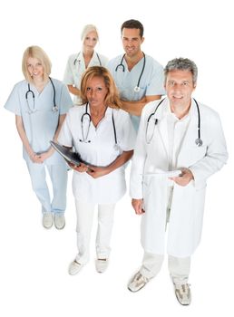 Top view of diverse medical team looking up on white background