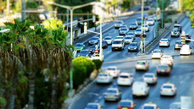 Israeli city at rush hour. Vehicles waiting in road junction.
Miniature Effect.