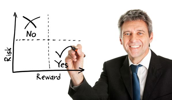 Businessman  drawing a risk-reward diagram. Isolated on white