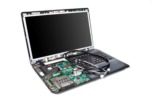 Laptop half disassembled with stethoscope on it