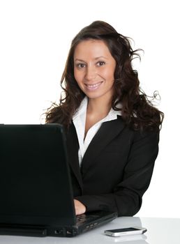 Beautiful business woman working on laptop. Isolated on white