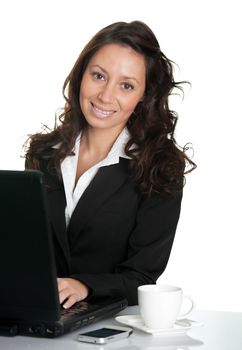 Beautiful business woman working on laptop. Isolated on white