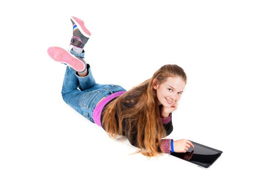 a beautiful young and modern girl with a tablet on a white background