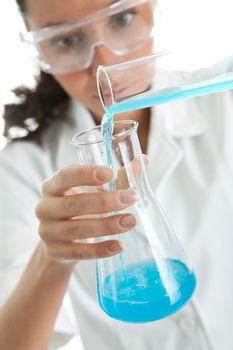 Woman involved in chemical research. Isolated on white