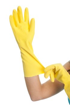 Close-up on female hands wearing protective rubber gloves. Isolated on white