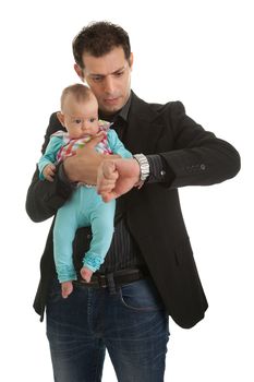 Young businessman holding a kid in hand and checking time