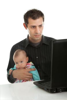 Handsome young father with his daughter working on laptop