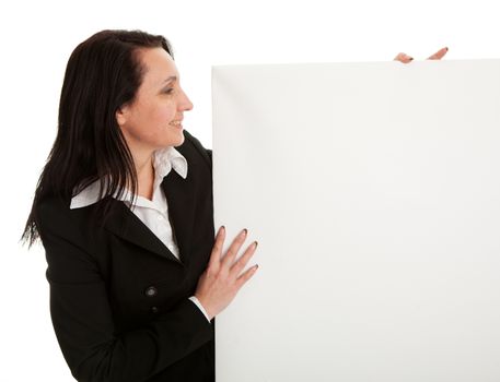 Cheerful businesswomen presenting empty board. Isolated on white