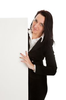 Cheerful businesswomen presenting empty board. Isolated on white