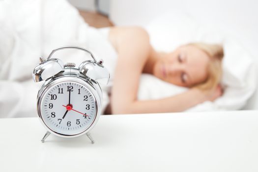 Young beautiful woman sleeping in bed at home