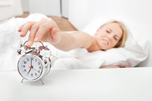 Young beautiful woman sleeping in bed at home