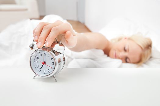 Young beautiful woman sleeping in bed at home