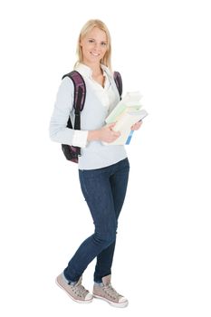 Portrait of beautiful student girl with books. Isolated on white