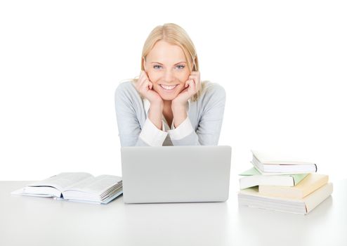 Beautiful student girl studying with laptop at the desk. Isolated on white