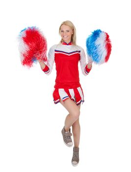 Smiling beautiful cheerleader with pompoms. Isolated on white