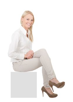 Businesswoman sitting on copyspace. Isolated on white