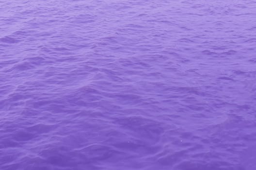 In the open tropical sea , purple water surface