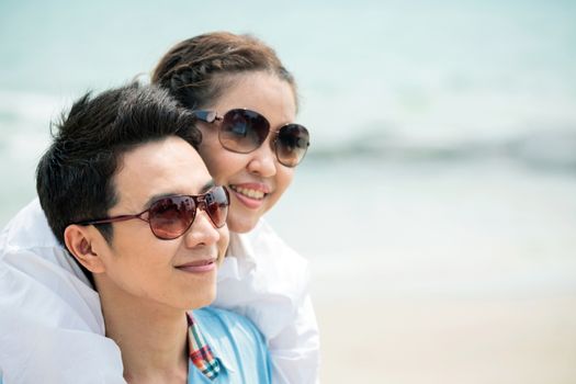 Happy Young Adult Couples in love outdoor at beach