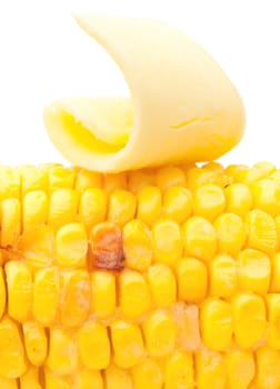 Closeup of butter melting on cooked corn on the cob