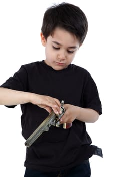 Male child playing with a gun on white background