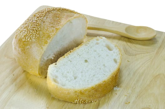 slices of  bread with sesame seeds on wooden board