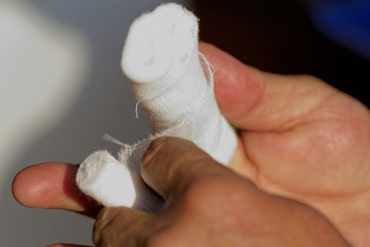 white medicine bandage on injury finger