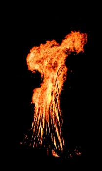 red flames of huge bonfire or campfire as black backgorund