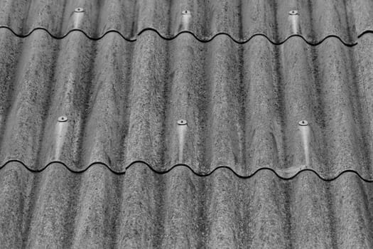 monochrome texture of gray corrugated slate roof