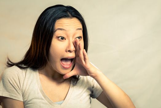 Young woman shouting, with fashion tone and background