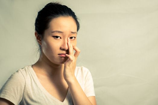 Portrait of young woman crying desperately, with fashion tone and background