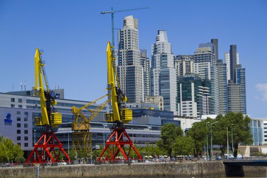 Antique crane, Residential and Office buildings of Puerto Madero in Buenos Aires.