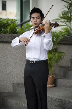 Thailand asia man with his violin he is a soloist