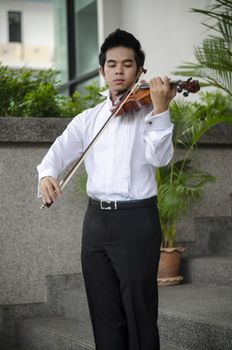 Thailand asia man with his violin he is a soloist